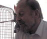 My Dad with our African Grey, Sara